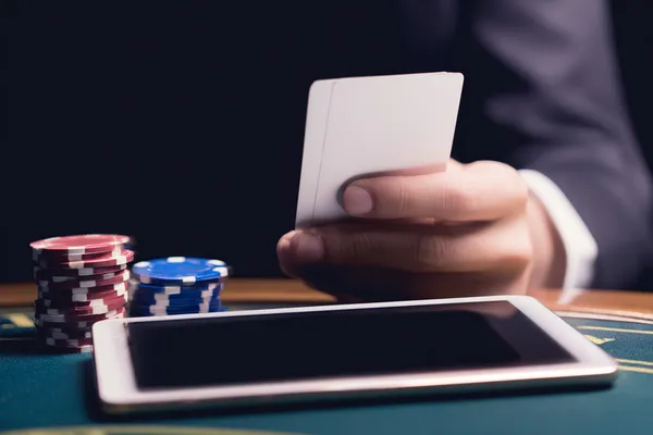 A confident dealer surrounded by casino chips inviting players to access their BDTLJ account, reflecting quick and easy login options.